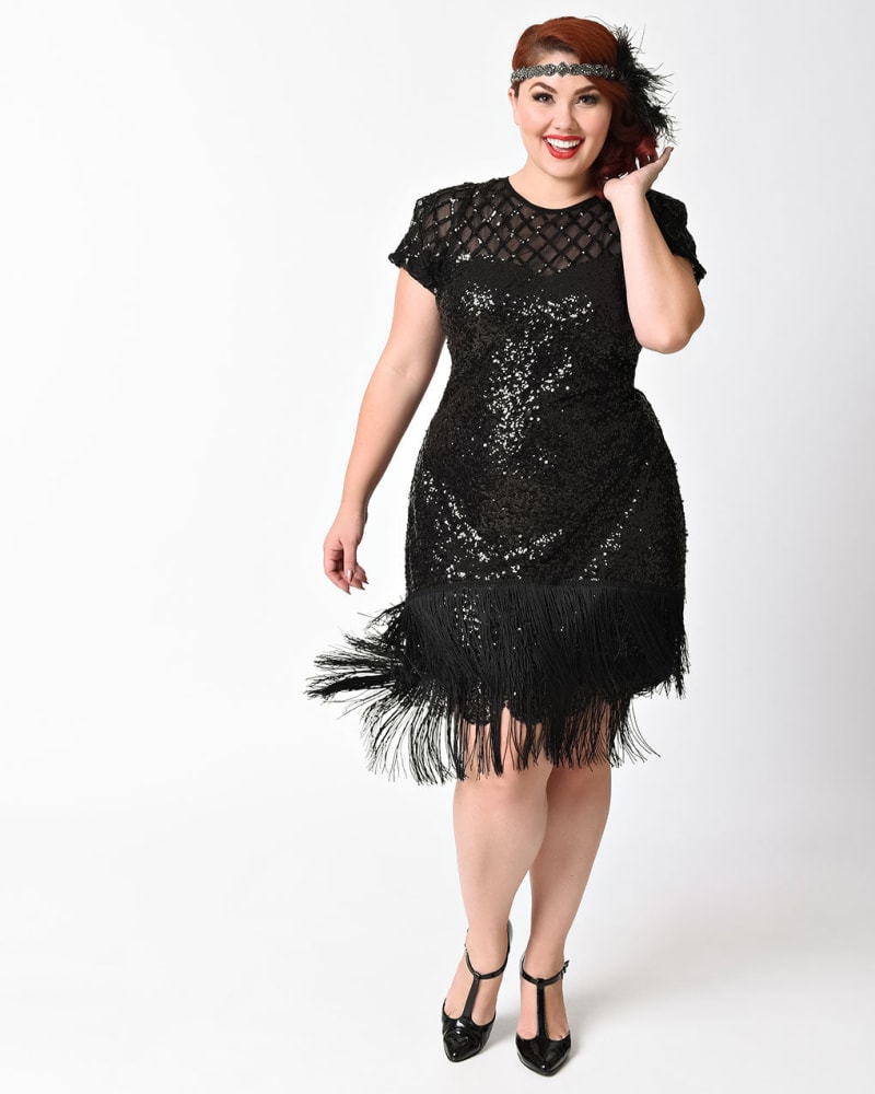 Front of a model wearing a size L Unique Vintage 1920s Black Sequin Fringe Del Mar Flapper Dress in Black by Unique Vintage. | dia_product_style_image_id:288419